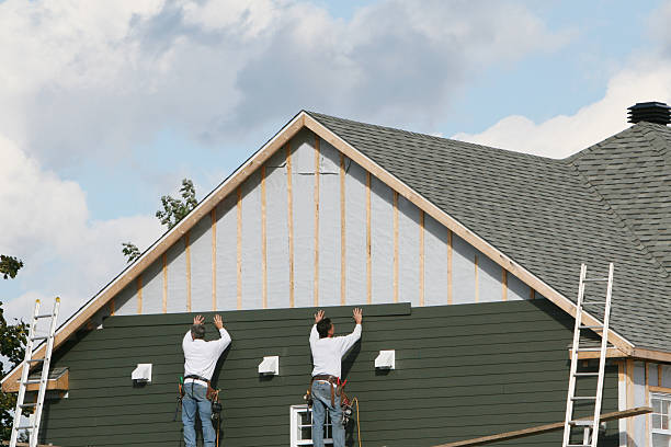 Professional Storm Damage Siding Repair technician working in Jackson, MN